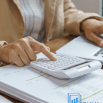 Business owner reviewing year-end financial records with clarity and intention